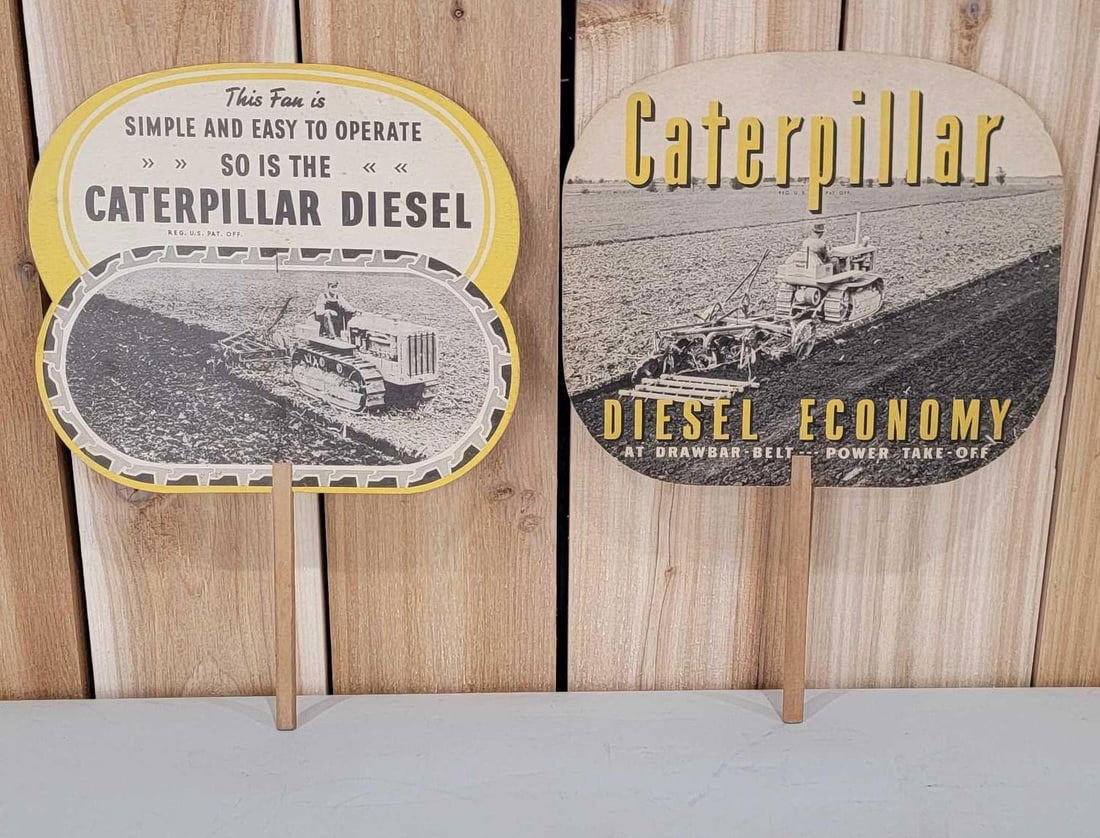 2-Different Caterpillar Diesel Cardboard Hand Fans: 9"x10", one is slightly yellowed.