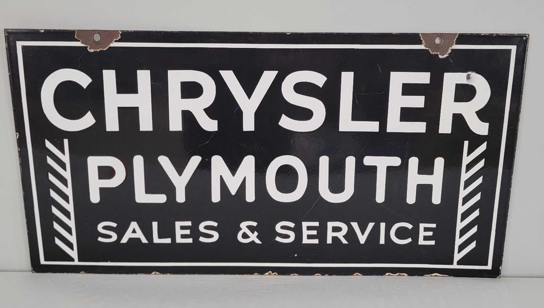 Chrysler Plymouth Sales & Service Porcelain Sign (TAC): rated 8.5, 18"x35". This DSP sign has good color and gloss with light marks and wear. Sign has slight bow and chips at the mounting holes. Rarity 7. TAC #060993