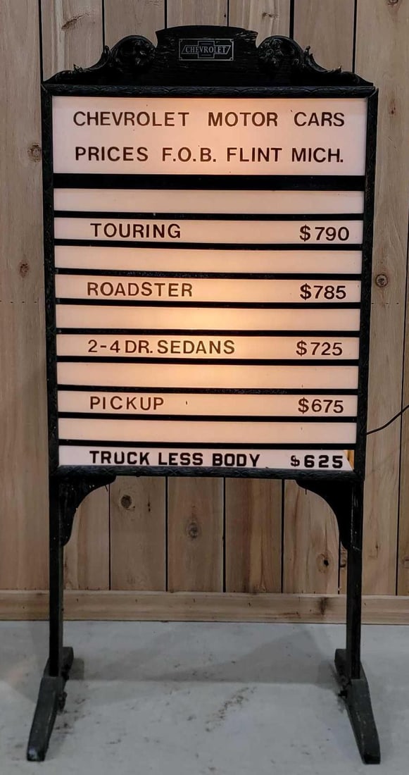 All Original Chevrolet Milk Glass Lighted Pricer Sign (TAC): rated 9. This lighted free standing pricer display has a wood and metal light box and finial complete with a Chevrolet Metal tag. Sign retains original milk glass panels with baked on lettering. The