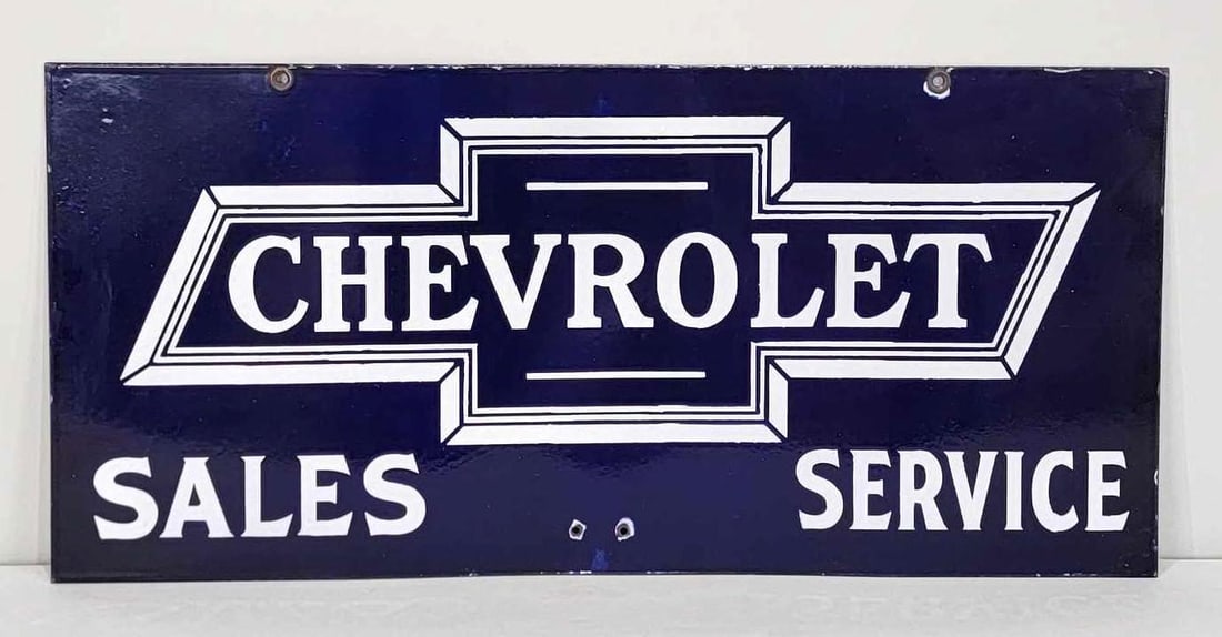 Chevrolet in Bowtie Sales & Service Porcelain Sign (TAC): rated 9, 14"x30", the DSP sign has vivid color and strong gloss. Fields are clean with two small holes drilled one inch from the bottom edge. Sign shows minor wear around the perimeter. This