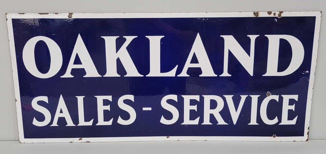 Oakland Sales-Service Porcelain Sign (TAC): rated 8.9, 17.75"x40". The DSP sign has excellent color and gloss, with only light wear, and chips in the right-hand field and around the perimeter. Rarity 8. TAC #060945
