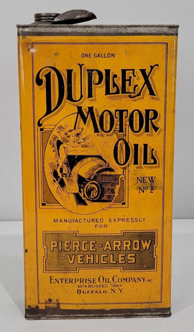 Duplex Motor Oil made for Pierce-Arrow Vehicles One-Gallon Flat Metal Can: rated 8.5 & 8. This one gallon flat metal can has very good color and shine with only light wear and dings. The reverse side has more wear. Can is empty, has lid and spout. Rarity 5.