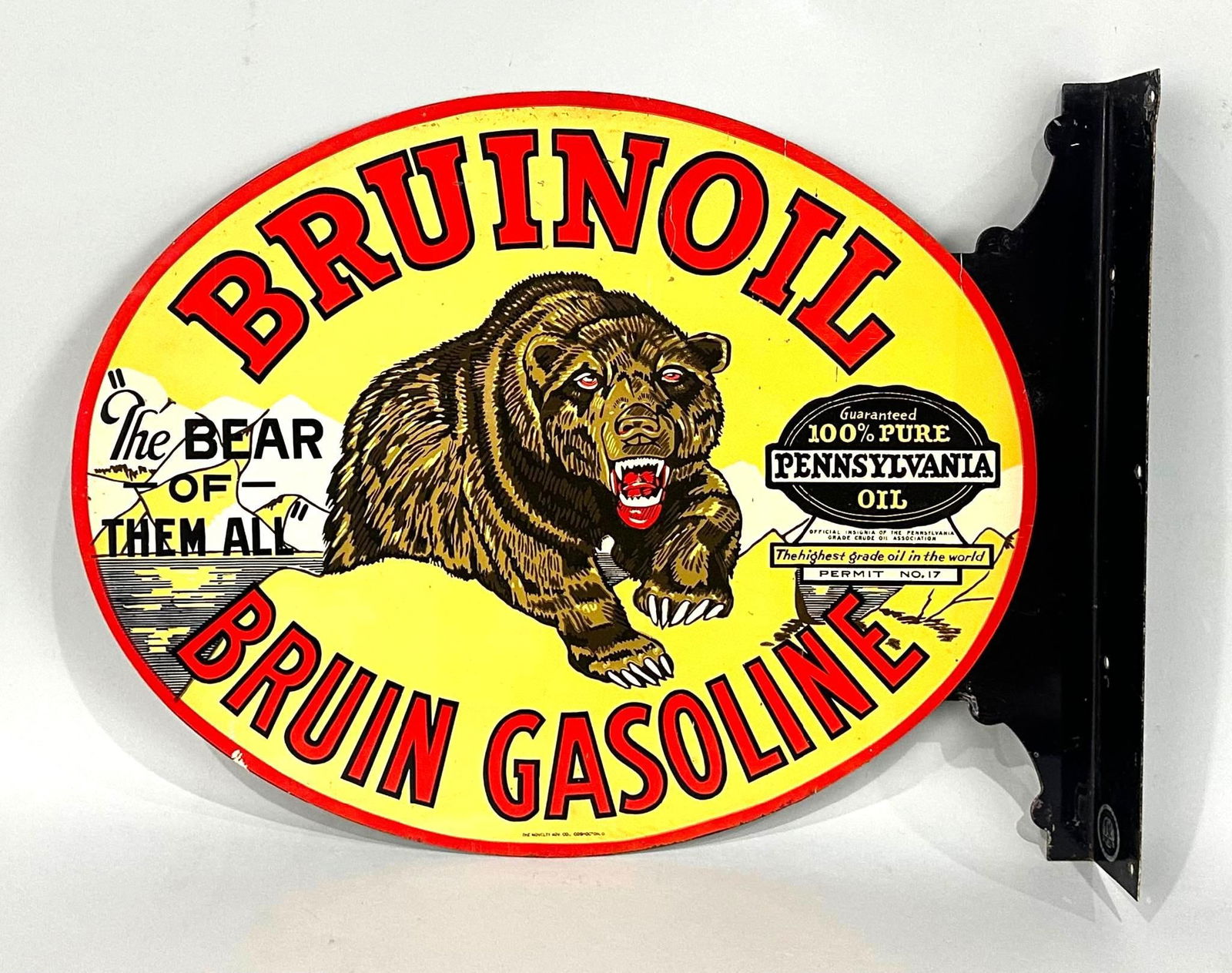 Bruinoil Bruin Gasoline "The Bear of Them All" w/Image Metal Flange Sign (TAC): rated 9, 13.5"x18". This extremely hard to find die-cut metal flange sign has excellent color and shine. The flange features an exceptionally detailed Bear graphic that remains in fantastic di
