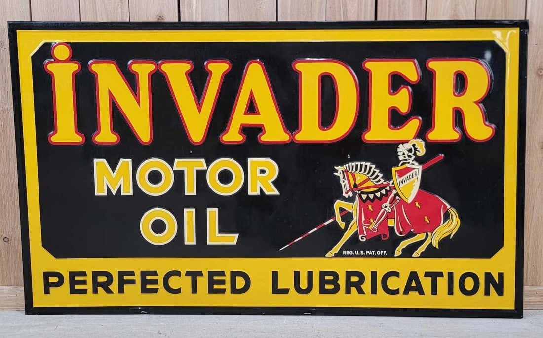 Invader Motor Oil "Perfect Lubrication" w/Knight Logo Metal Sign (TAC): rated 9c. 34"x58". This SST embossed wood backed sign has excellent color and shine with only one tiny paint chip on the center hanging holes. Sign has a slight dent on the bottom edge. This is