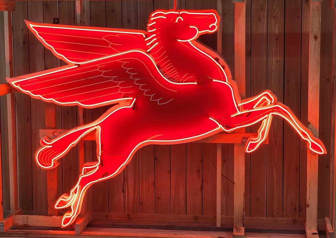 Rare All Original Mobil Pegasus "Shelf Sitting" Right-Hand Facing Neon Sign (TAC): rated 9, 72"x108"x11.5". This original neon porcelain cookie-cutter sign has very good color and gloss. Sign has minor chips and rust staining along the perimeter. Marked T-53. This Pegasu
