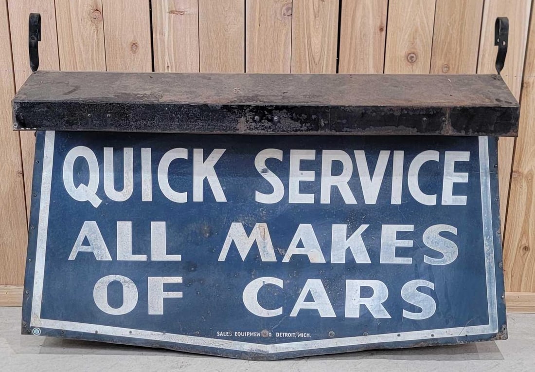 (Ford) Quick Service All Makes of Cars 2-Metal Signs Under Lighted Hood (TAC): rated 7.5, signs measure 28"x56.5", overall 38"x56"x18", the 2-SST die-cut sign have wear and are slightly faded, white color is thin, marked Sales Equipment CO. Detroit, Mich., the metal l