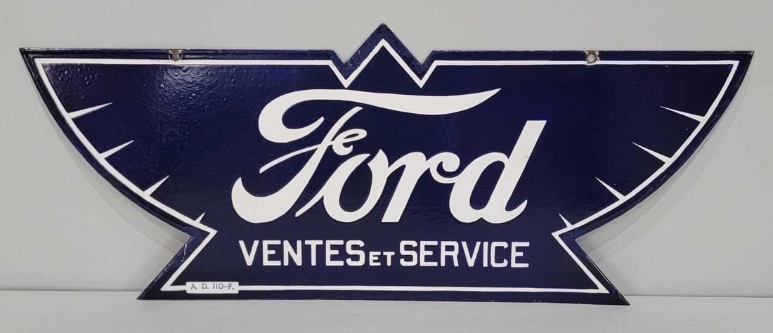 Ford Ventes et Service Porcelain Sign (TAC): rated 8.5, 12"x29.75", the DSP die-cut sign has good color and gloss, has light wear in the field, has touched up chips around the perimeter, marked A.D. 110F. French/Canadian. Rarity 7. TAC #033815