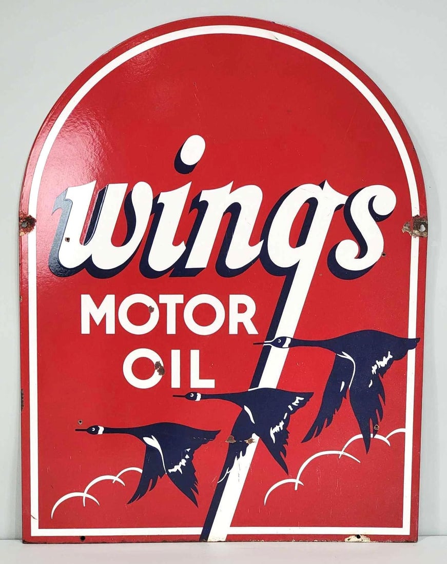 Wings Motor Oil w/Logo Porcelain Sign (TAC): rated 8.5, & 8.25 34.5"x26.5", the DSP tombstone-shaped sign has good color and gloss. Display has a few small chips in the field, as well as, an extra hole drilled near the left-hand edge