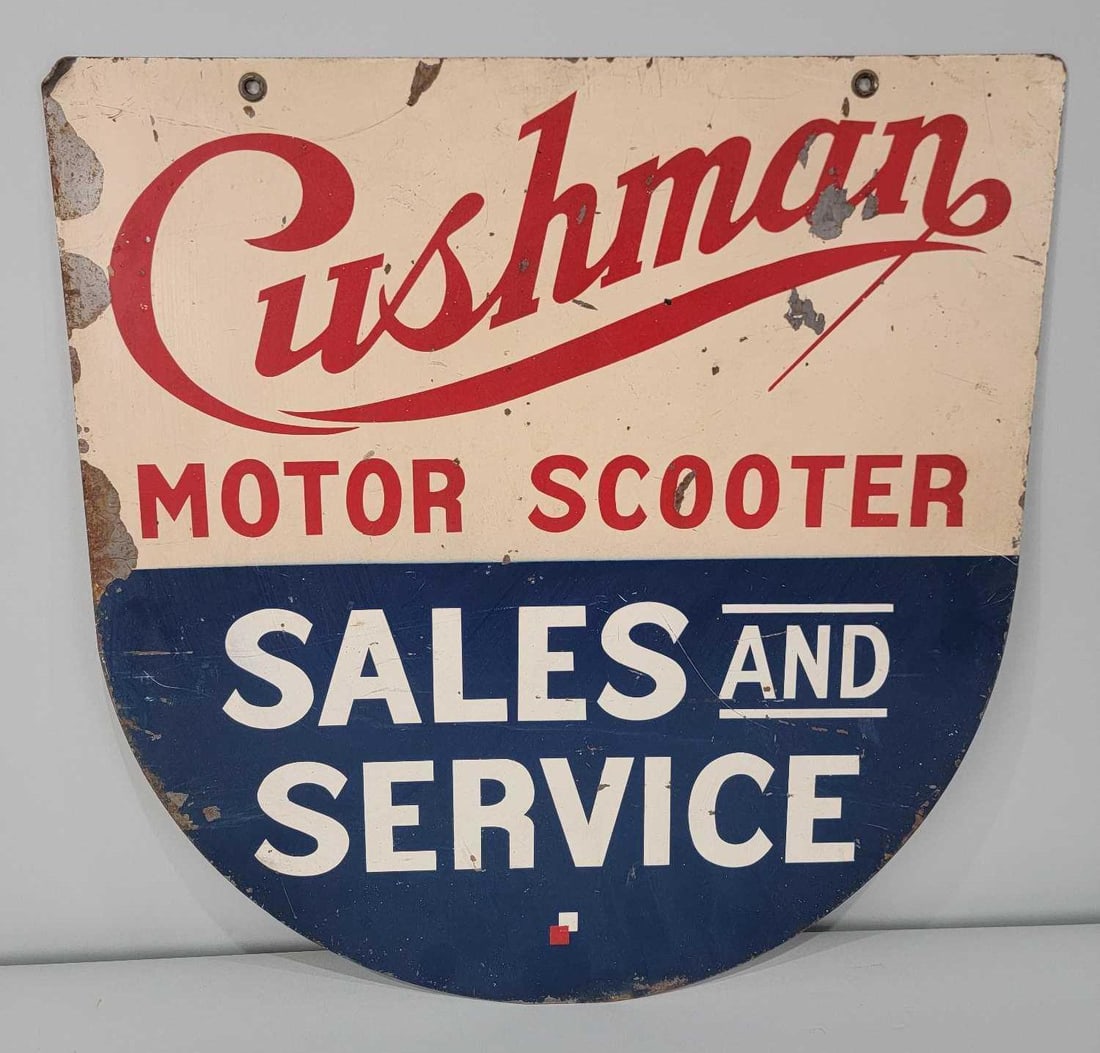 Cushman Motor Scooter Sales & Service Metal Sign: rated 7.5 & 6.5, 21"x20", the DST die-cut sign has good color, has paint loss and spots, reverse has heavier paint loss.