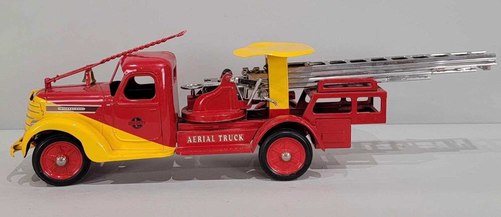 Buddy "L" International Aerial Truck "Ride-on Press Steel Truck (restored): 41"L, the press steel truck has been restored.