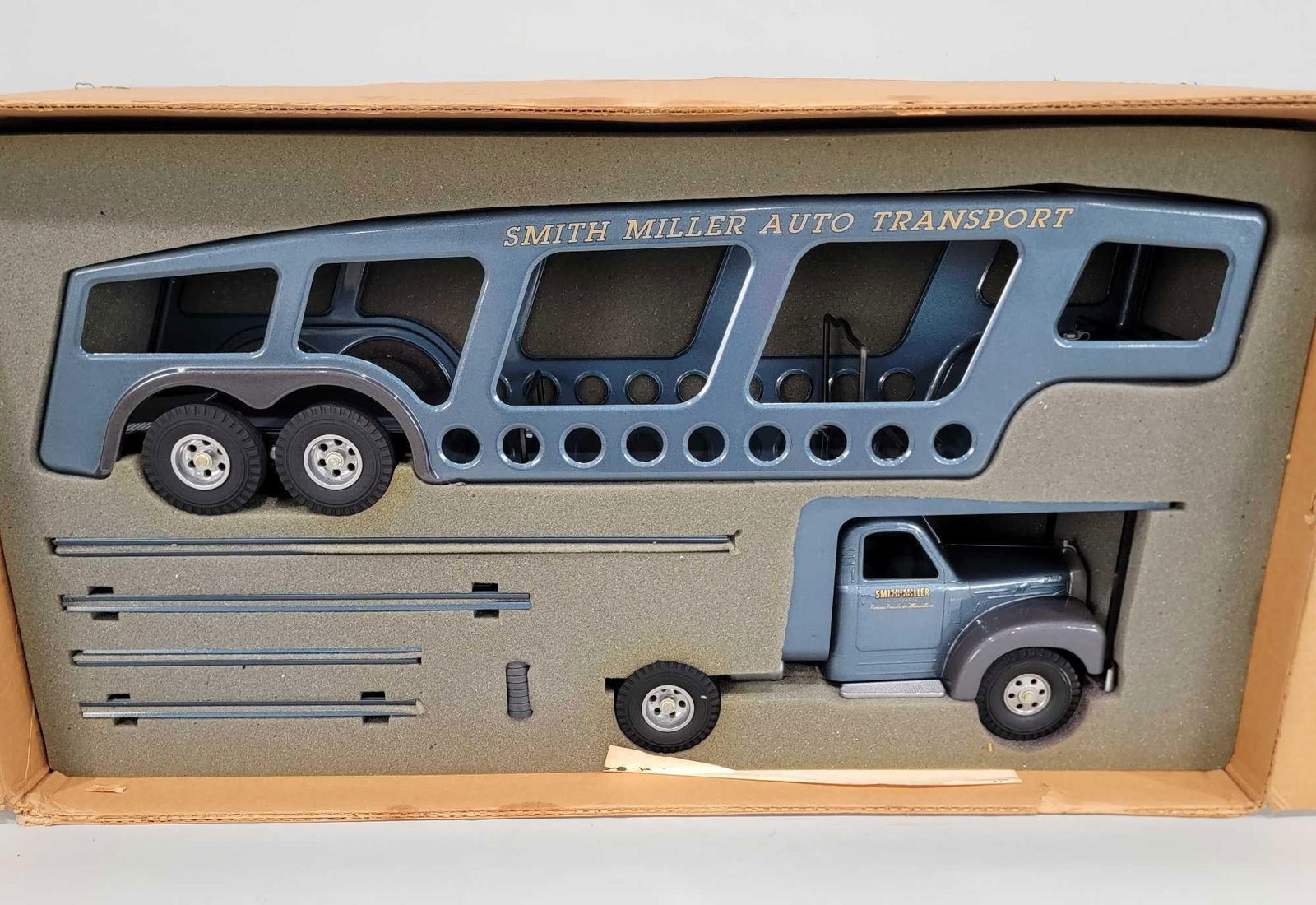 Fred Thompson Smith-Miller Auto Transport "B" Mack NIB: rated 9.5, 38"L. the truck and trailer are new in the box, we opened it for the first time. Box has wear and staining, seam damage.