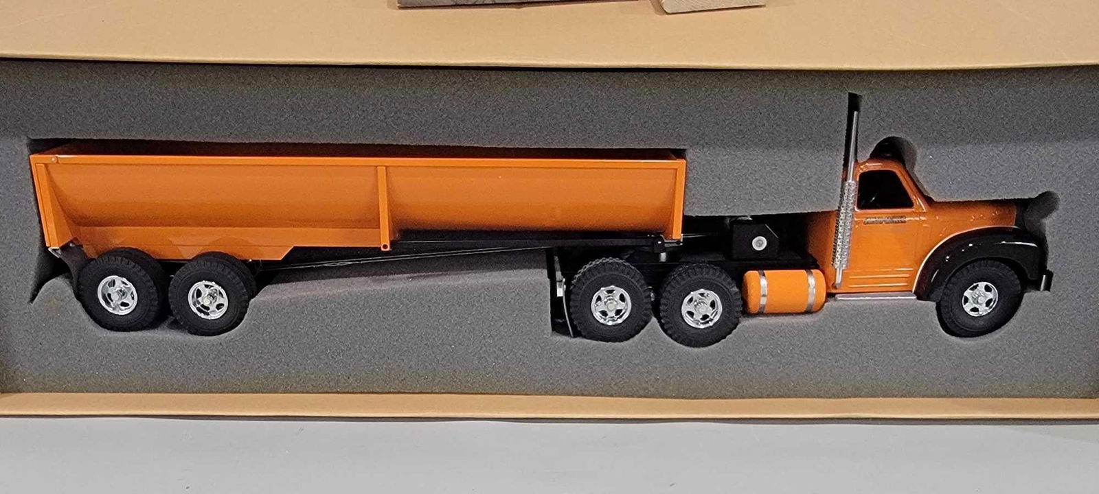 Fred Thompson Smith-Miller "B" Mack Semi with Dump Trailer (TAC): rated 9.5, 38"L. the truck and trailer are new in the box, box has wear and staining.