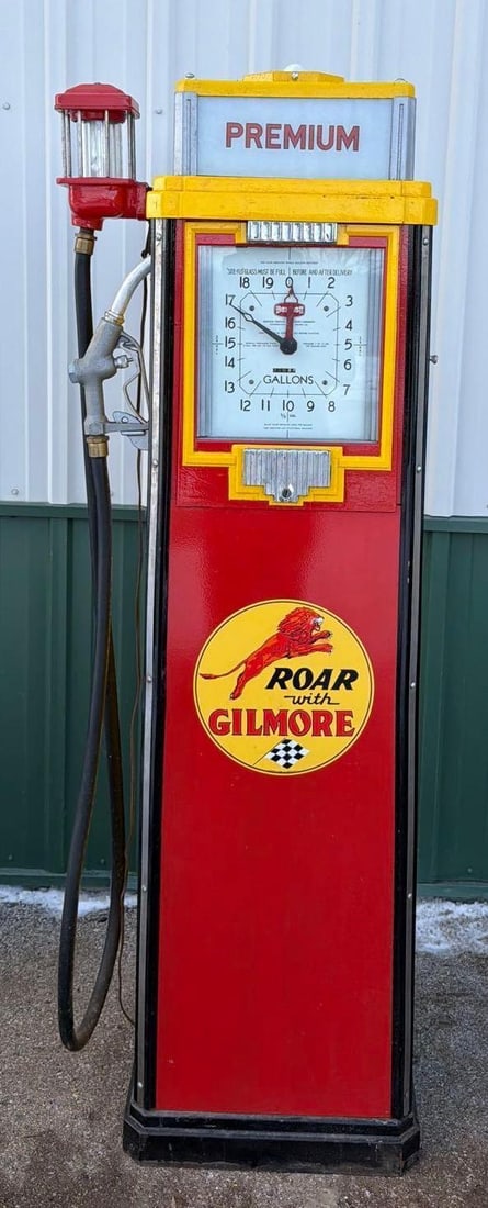 1936 Tokheim Model #36-B Clock Face Gas Pump (restored): 76"T., the gas pump has been professionally restored in Gilmore colors and new decal, has an original spinner gauge, hose and nozzle. This Item must be picked up in Wisconsin