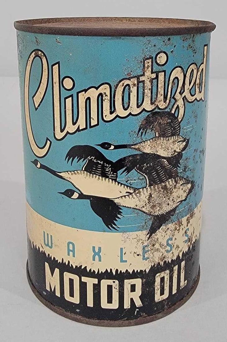 Climatized Motor Oil w/Geese Image One Quart Round Metal Can (TAC): rated 6 & 2, the one quart round metal can with soldered seam, is empty, display has wear and rust, reverse is almost gone. TAC #061306