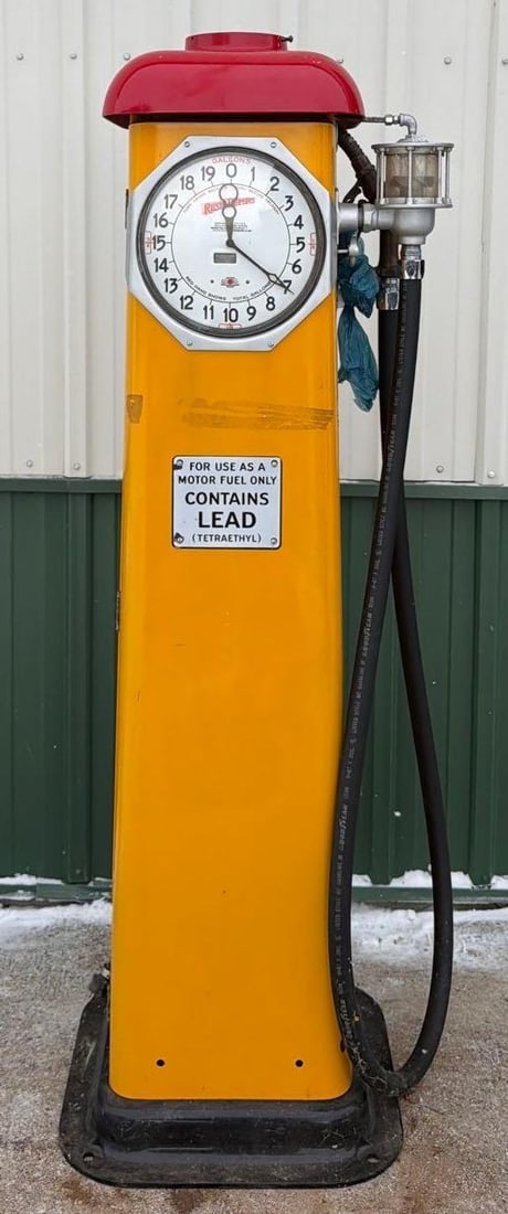 1932 Rush Model #M-2 Clock Face Gas Pump (restored): 74"T., the pump has been restored in Shell colors yellow body red top, comes with spinner gauge, black hose and nozzle. This Item must be picked up in Wisconsin