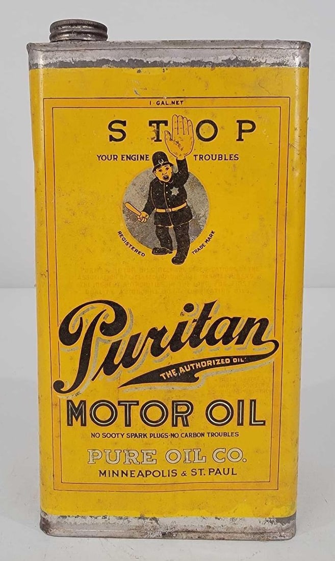 Puritan Motor Oil w/Cop Logo One Gallon Metal Can: rated 8.5, the one gallon metal can has good color has light wear, is empty, one lid is missing.