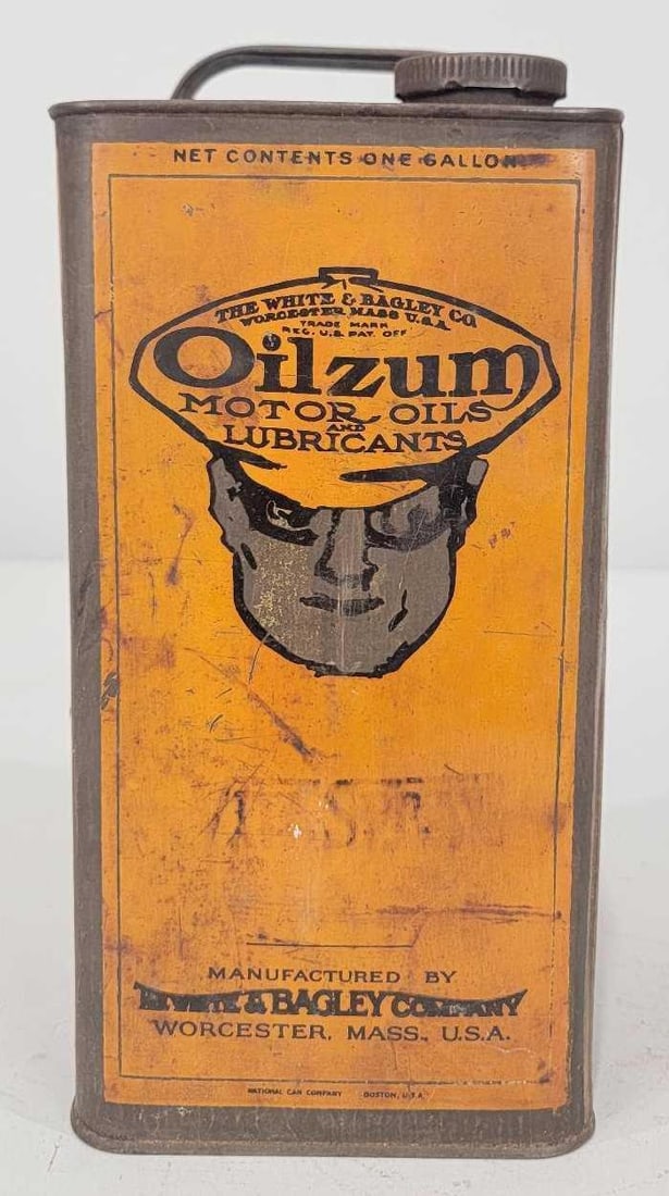 Oilzum Motor Oil One-Gallon Square Metal Can: rated 7, the one gallon square metal can has wear and soiling, is empty, has lid.