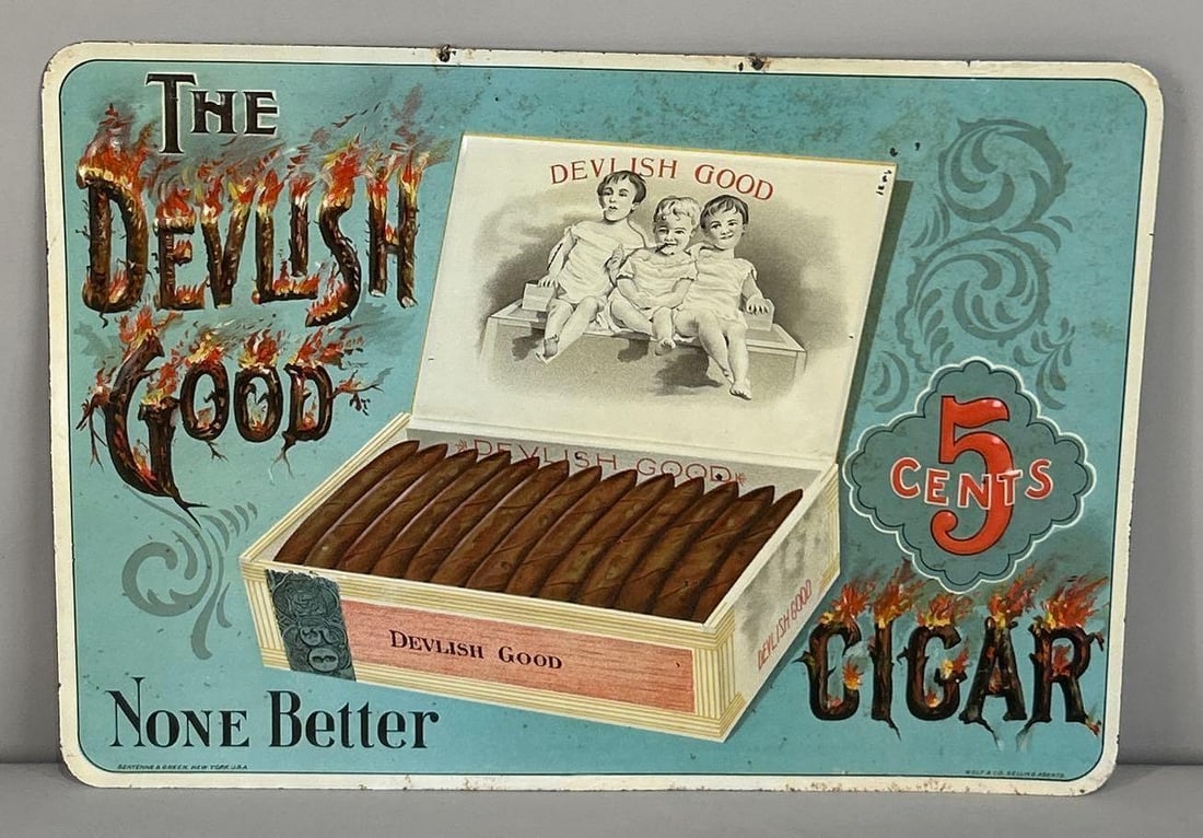 The Devlish Good 5¢ Cigar Lithograph On embossed Tin Sign W/ Full Cigar Box Graphic: (Rated 8.75). 10" x 13.75". This SST sign has good color and gloss throughout the field. Sign has non distracting paint loss in the field, as well as, surface staining along the outer field. Outer