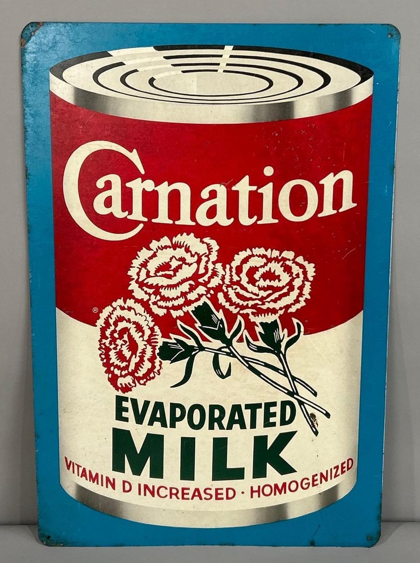 Carnation Evaporated Milk Tin Sign: Rated 8. 11.75" x 17.75". This SST has good color with minor paint loss throughout the field. Sign shows areas of staining and paint loss on the corners. Marked, " C 325". Rarity 4. TAC #061885
