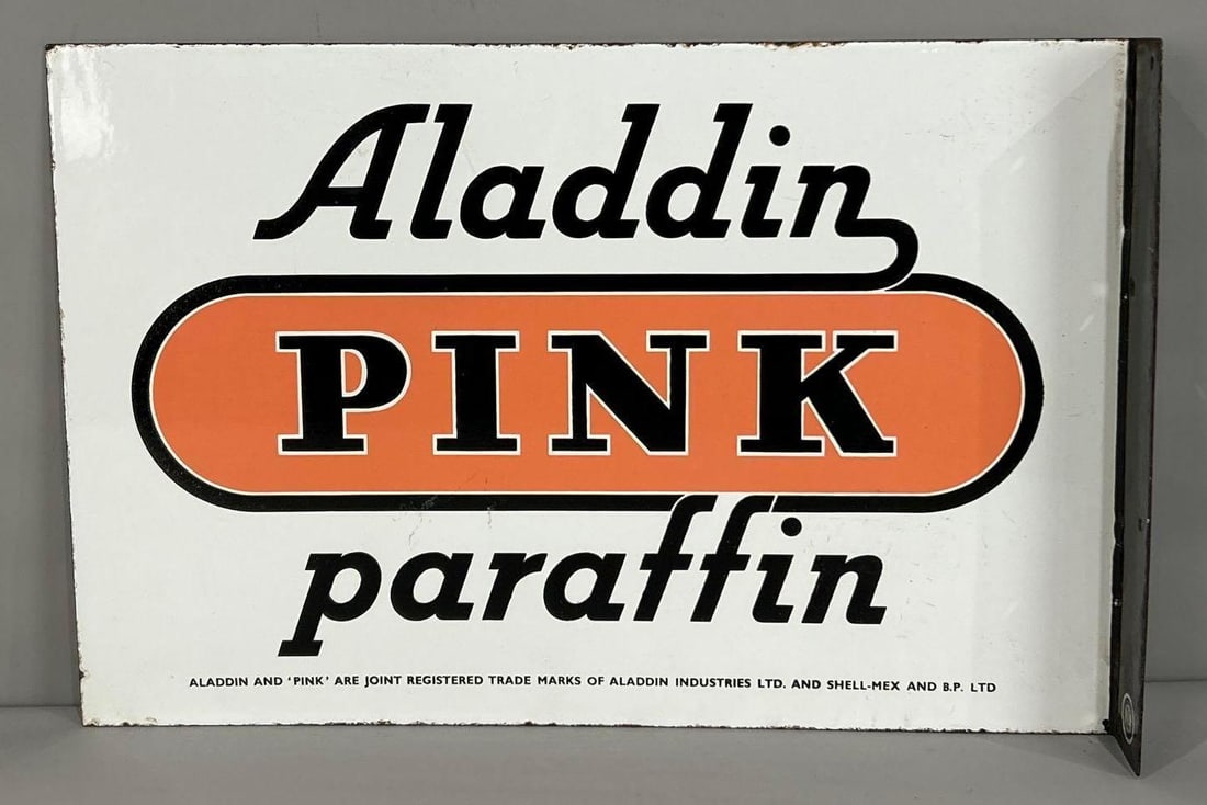 Aladdin Pink Paraffin Porcelain Flange Sign (TAC): rated 9+, 14"x21', the porcelain flange sign has excellent color and gloss, fields are clean, wear around the perimeter. TAC #062656