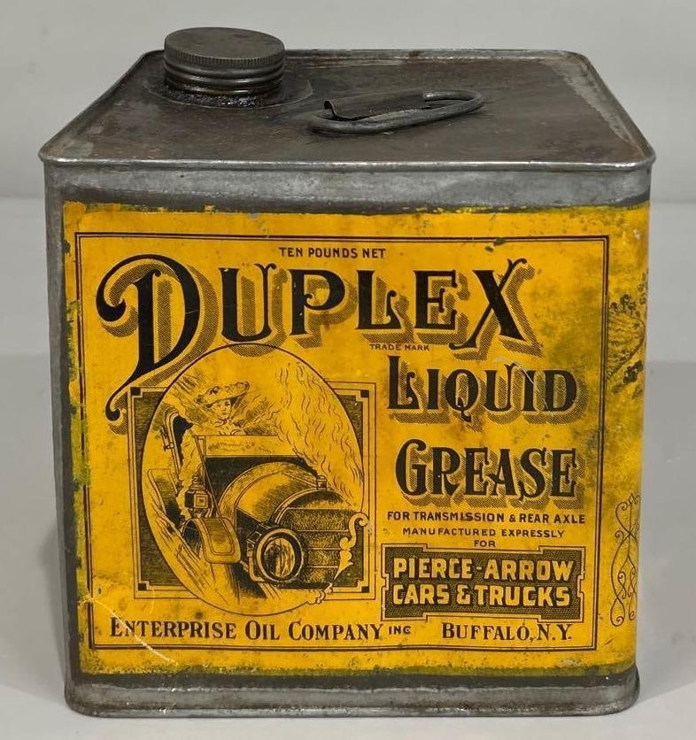 Duplex Grease Ten Pound Grease Can: rated 7 to 8, the square ten pound grease can has good color, has wear and fine scratches, is empty.
