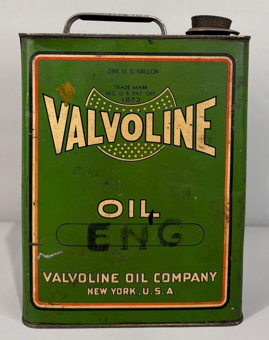 Valvoline Motor Oil One Gallon Can: rated 7, the one gallon flat metal can, is empty, has wear and soiling, reverse has more.
