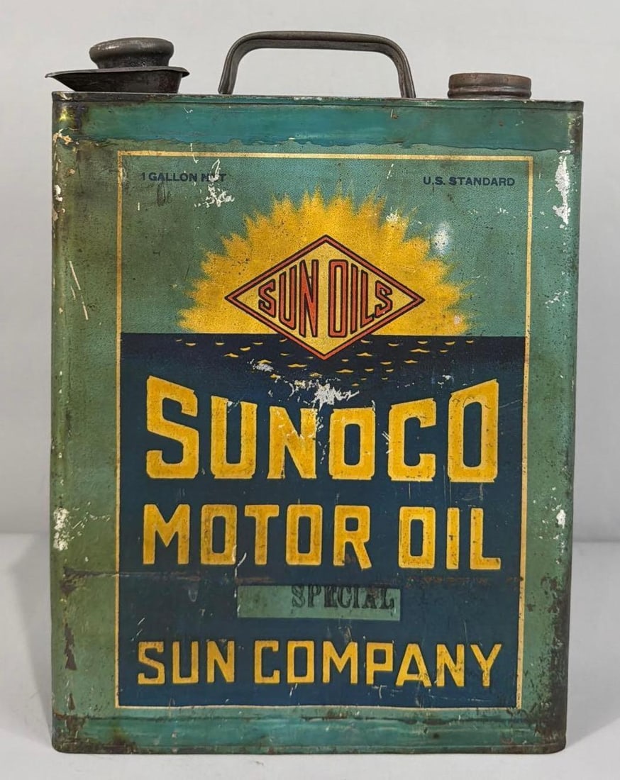 Sunoco Motor Oil Flat Metal Can: rated 6.5, the one gallon flat metal can, is empty, has wear, soiling, dings.