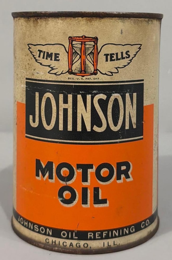 Johnson Motor Oil Quart Can: rated 6.5, the one quart round metal can, soldered seam, is empty, has soiling and wear.