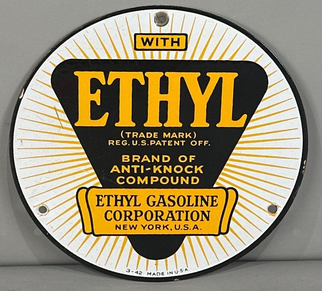 Ethyl Single-Sided Porcelain Sign: (Rated 9.0). 8" dia. This SSP sign has surface stains and minor porcelain loss on outer edge. Rarity 2. 