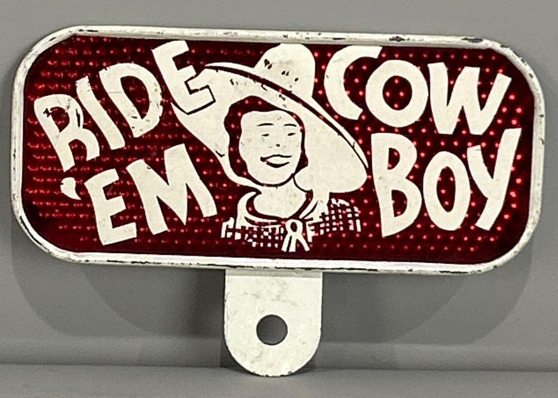 Ride'Em Cowboy Metal & Reflective License Plate Attachment: rated 8.75, 3.5"x5.5", has light wear.
