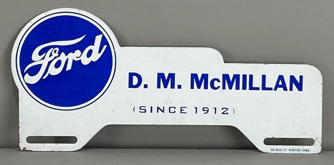 Ford D.M. McMillan Metal License Plate Attachment: rated 9, 4"x10", has light wear, marked Ad. Nov.