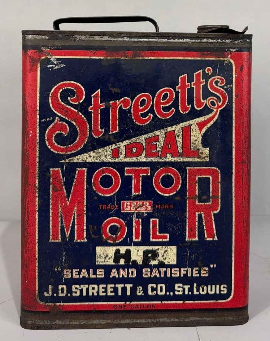 Streett's Ideal Motor Oil One Gallon Metal Can: rated 7, the one gallon flat metal can, is empty, has wear and scratches.
