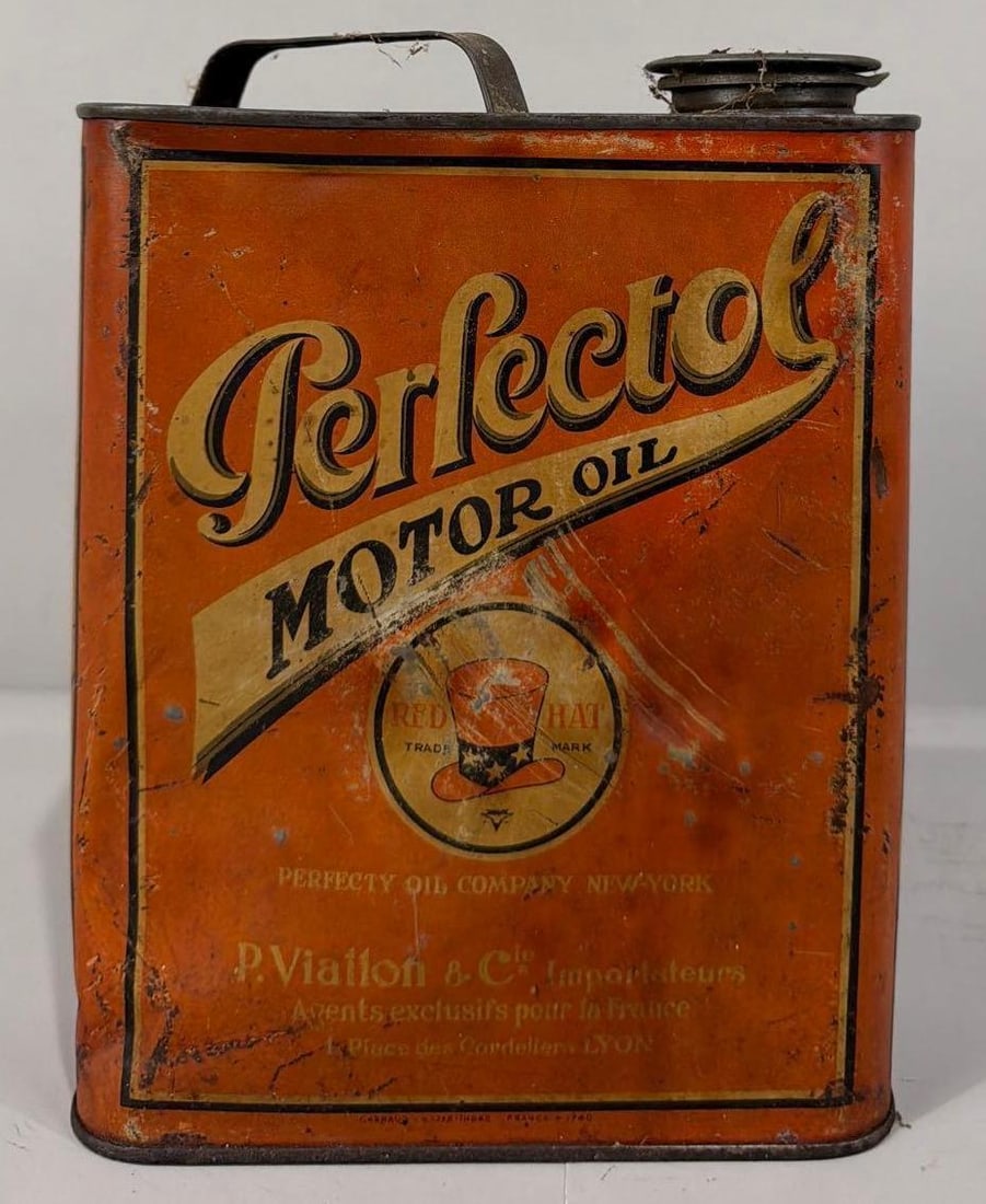 Refectol Motor Oil w/Red Hat Logo One Liter? Metal Can: rated 6, the metal flat can, has wear, fading and dings.