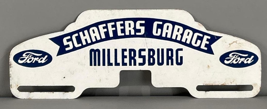 Ford Millersburg Metal License Plate Attachment: rated 8.5, 4"x10", has light wear.