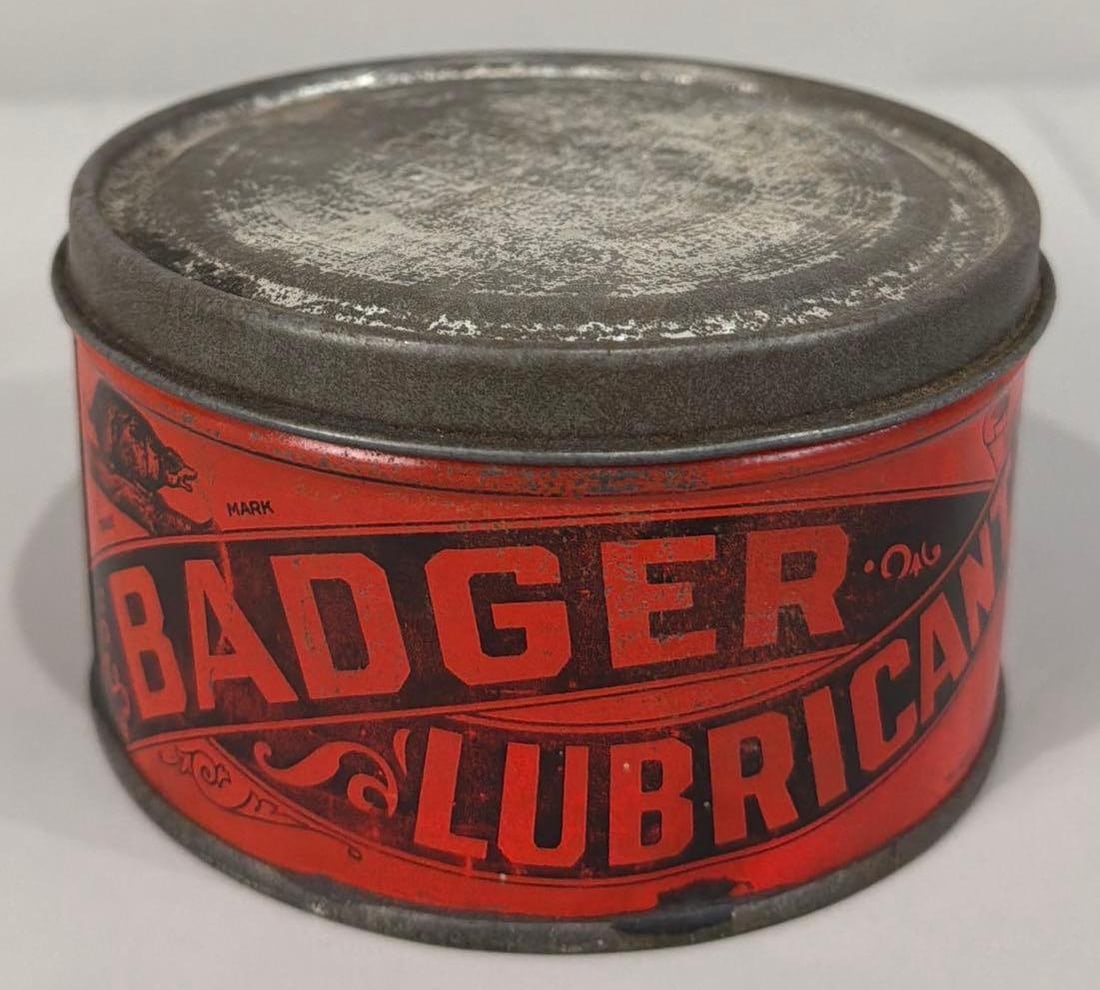 Badger Lubricant w/Logo Grease Metal Can: rated 9, 4,5"D., in good condition, is empty.