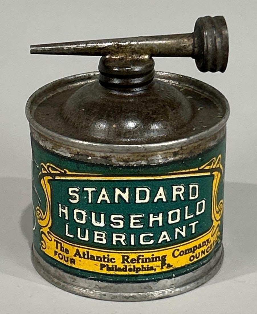 Atlantic Refining Standard Household Lub 4oz. Metal Can: rated 8.25, the 4 oz. round handy oiler can has good color, has wear, is empty.