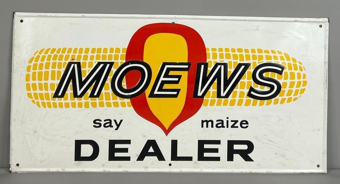 Moews Maize Dealer Self-Framed Embossed Tin Sign: (Rated 8.0). 18" x 36". This SST sign has good color and gloss with significant surface staining throughout. Outer edge shows paint loss. Rarity 2. TAC # 062315