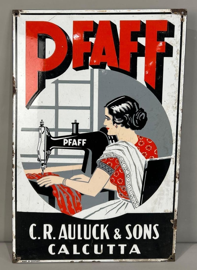 Pfaff (Sew Machines) w/Lady Porcelain Sign (TAC): rated 7.9, 28.5"x19", the SSP rolled edge sign has good color and gloss, has wear and marks in the field, has chips around the perimeter, marked Made in Germany. TAC #062945