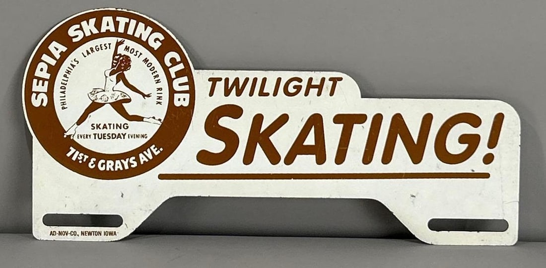 Sepia Skating Metal License Plate Attachment: rated 8.9, 5"x10", has light wear, marked Ad. Nov.