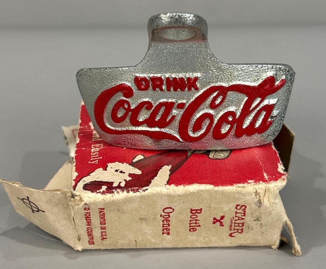 Coca-Cola Bottle Cap Remover: Rated NOS. 3"x 3"(box). This bottle cap remover is in excellent condition. Box present but is missing sections. Rarity 1.