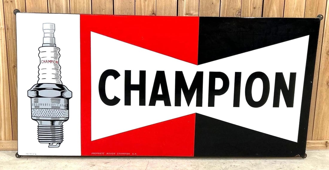Large Champion Porcelain Sign W/ Spark Plug Graphic: Rated, 9. 38" x 77". This SSP has over the top color, gloss and graphic. Sign shows minor staining, as well as, porcelain loss on the bottom right hand corner. Rarity 9. TAC # 043453.