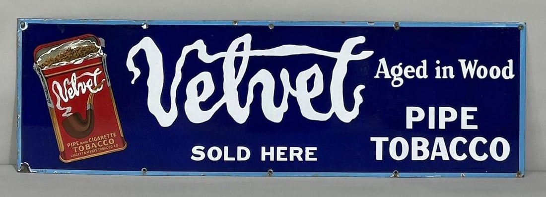Velvet Pipe Tobacco Sold Here w/Image Porcelain Sign (TAC): rated 9, 12"x39". This SSP sign has good color and gloss with a few light scratches in the field. Sign has chips around the perimeter. Rarity 3.TAC #061562
