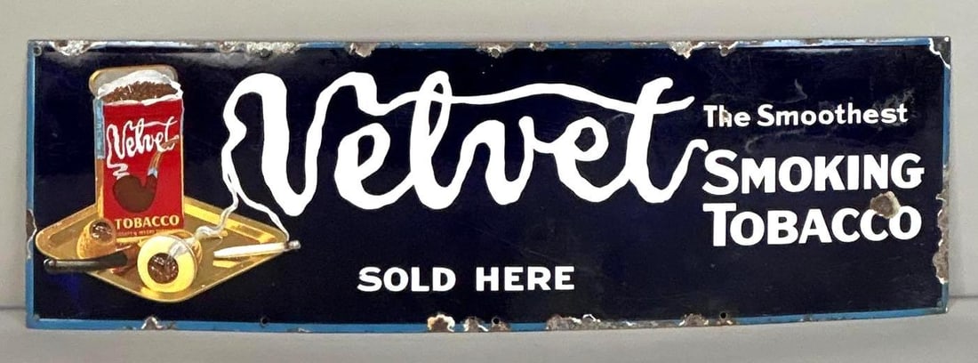 Velvet Tobacco Single-Sided Lithograph On Porcelain W/ Tobacco Tin Graphic: (Rated 7.9) 12" x 39". This SSP sign has fair color and gloss with minor oxidation in the background. Outer edge shows other areas of porcelain loss. Rarity 1. TAC # 062442.