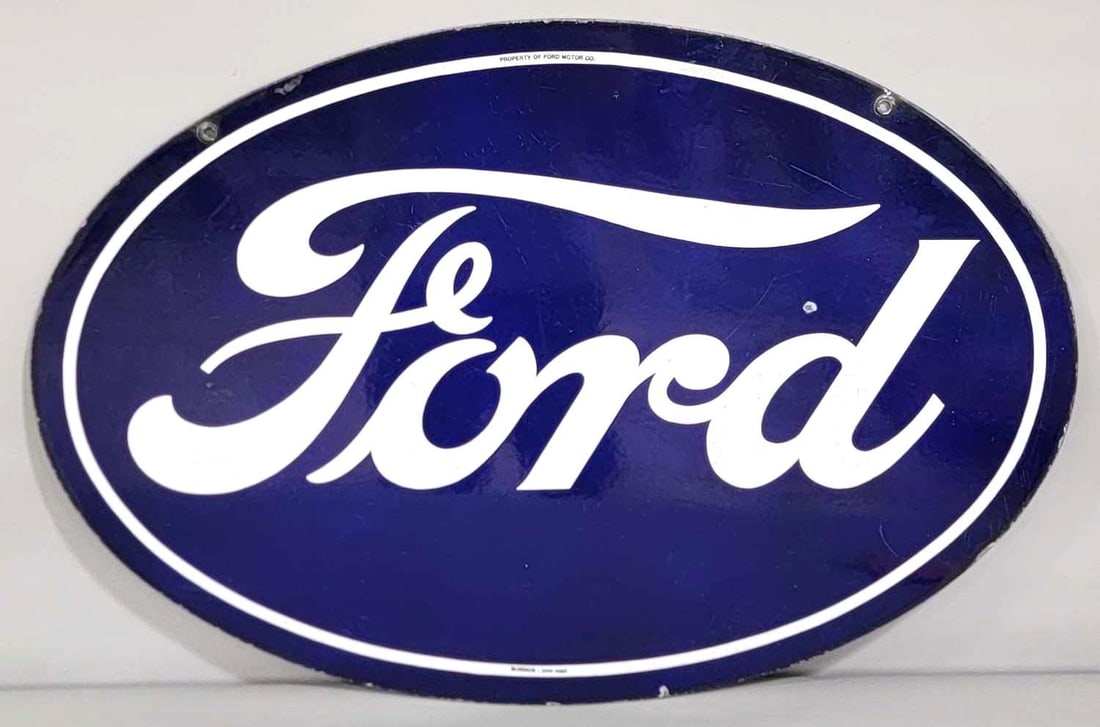 Ford Porcelain Oval Sign (TAC) (medium): rated 8.75 & 7.9, 22.5"x33". This DSP oval sign has good color and gloss. Display has light wear and small chips. Reverse has scratches, staining and chips. Marked, "Property of Ford Motor Co. & Burdi