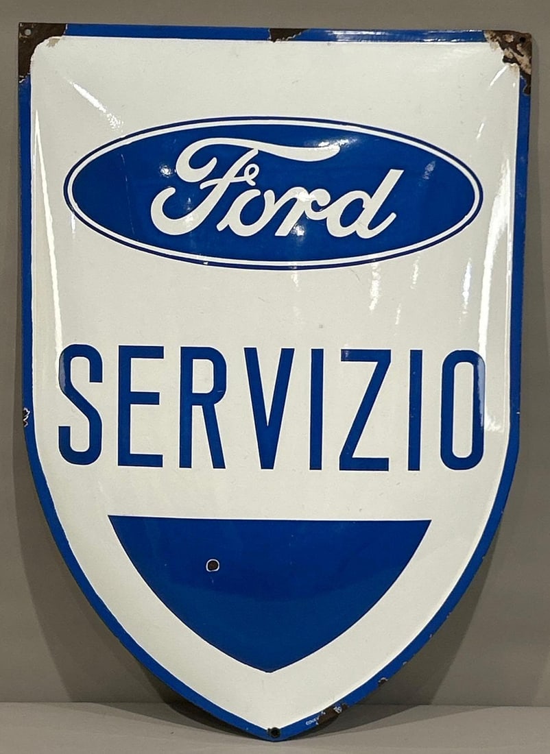 Ford Servizio Porcelain Sign (TAC): rated 8.5, 34"x24", the SSP pillow sign has excellent color and gloss, has one small chip in the lower field, chips around the perimeter, marked Covan----. TAC #062702