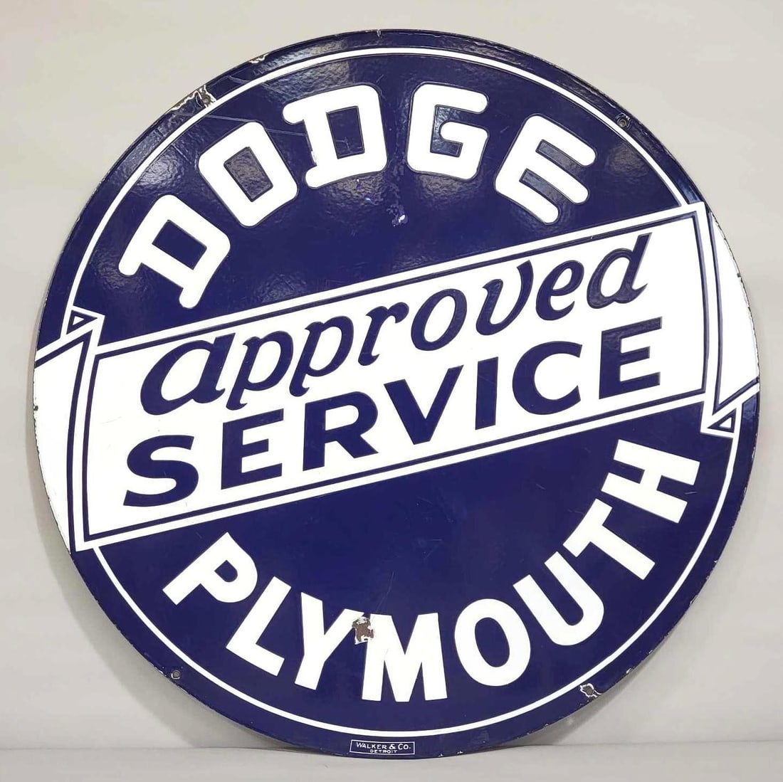 Dodge Plymouth Approved Service Porcelain Sign (TAC): rated 8.75, 42"D., the DSP sign has good color and gloss with a few chips in the fields. Marked, "Walker & Co." Rarity 6. TAC #043010