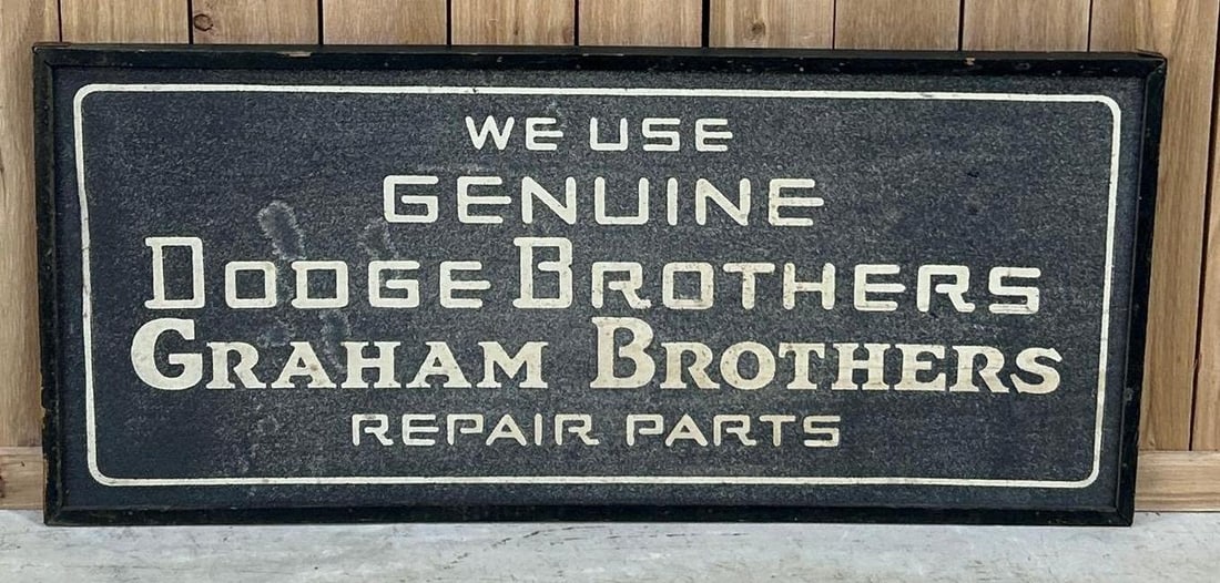 We Use Genuine Dodge Brothers Graham Bothers Repair Parts Smaltz Sign (TAC): rated 8.5, 22"x49". This double-sided Smaltz painted metal sign is in good condition. Smaltz paint is tight, lightly soiled. Rarity 10. TAC #061558