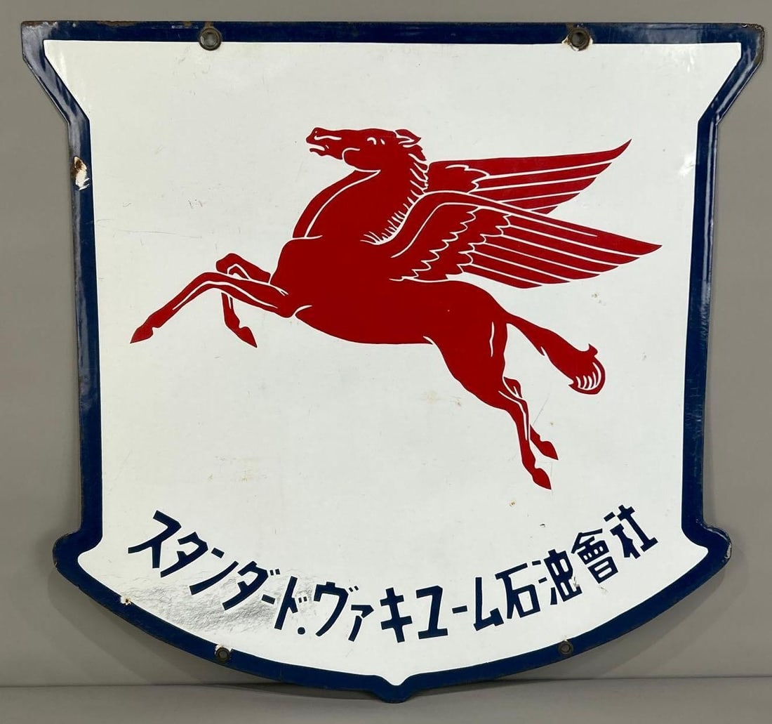 (Socony-Vacuum) Pegasus w/Foreign Writing Porcelain Sign (TAC): rated 8.75, 34.5"x35", the DSP shield-shaped sign has excellent color and gloss, has a few small chips and light wear in the field. TAC #062668