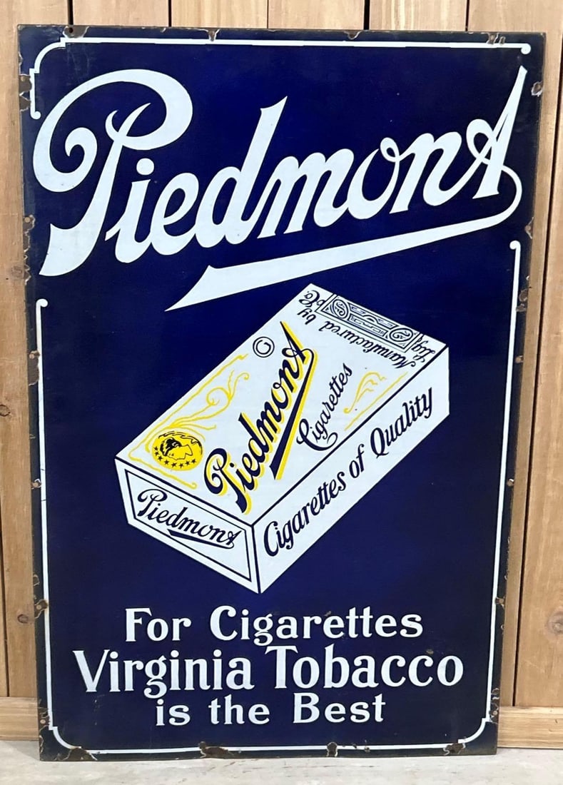 Piedmont Cigarettes w/Image Porcelain Sign (TAC): rated 9, 46"x30", the SSP sign has good color and gloss, has small chip in the lower field, chips around the perimeter. Rarity 3. TAC #062757