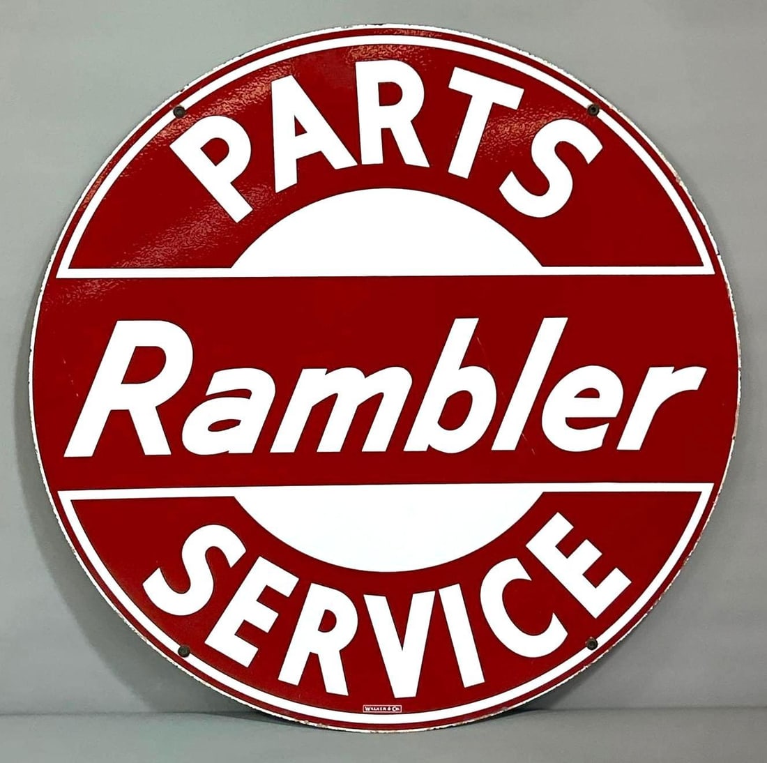Rambler Parts Service Porcelain Sign (TAC): rated 9.5 & 9, 42"D. This DSP sign has excellent color and gloss. Display is nice, while the reverse has a fine scratches in the outer field. Marked, "Walker & Co." rarity 3. TAC #061571